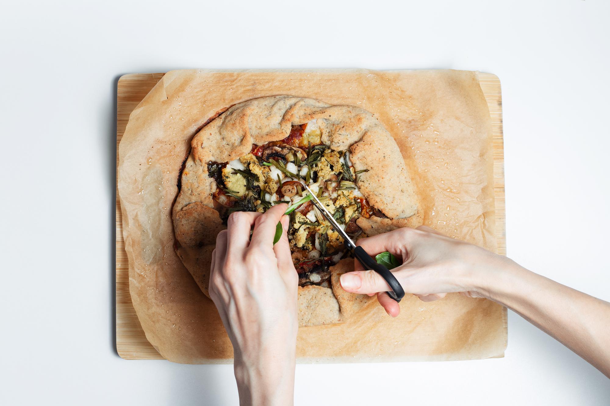 Chef arranging artisanal meal on wooden board